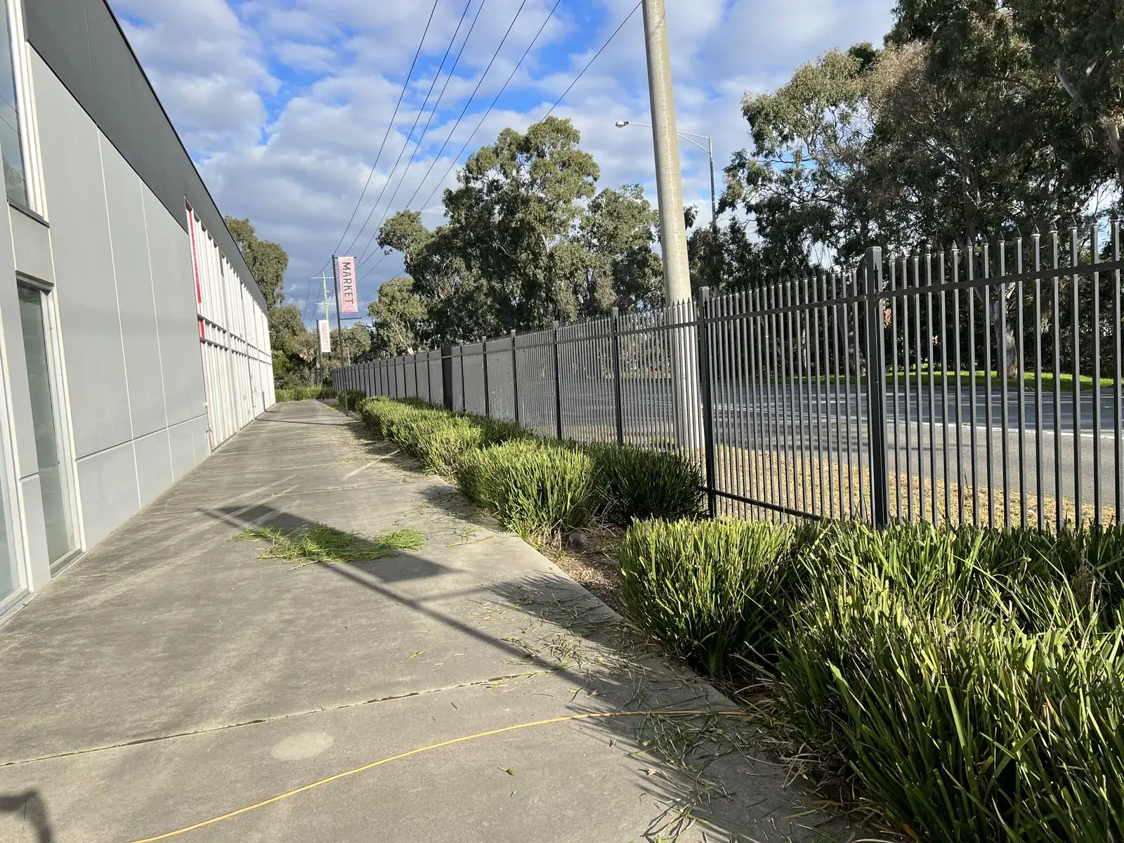 A long industrial fenceline kept clear and tidy year round