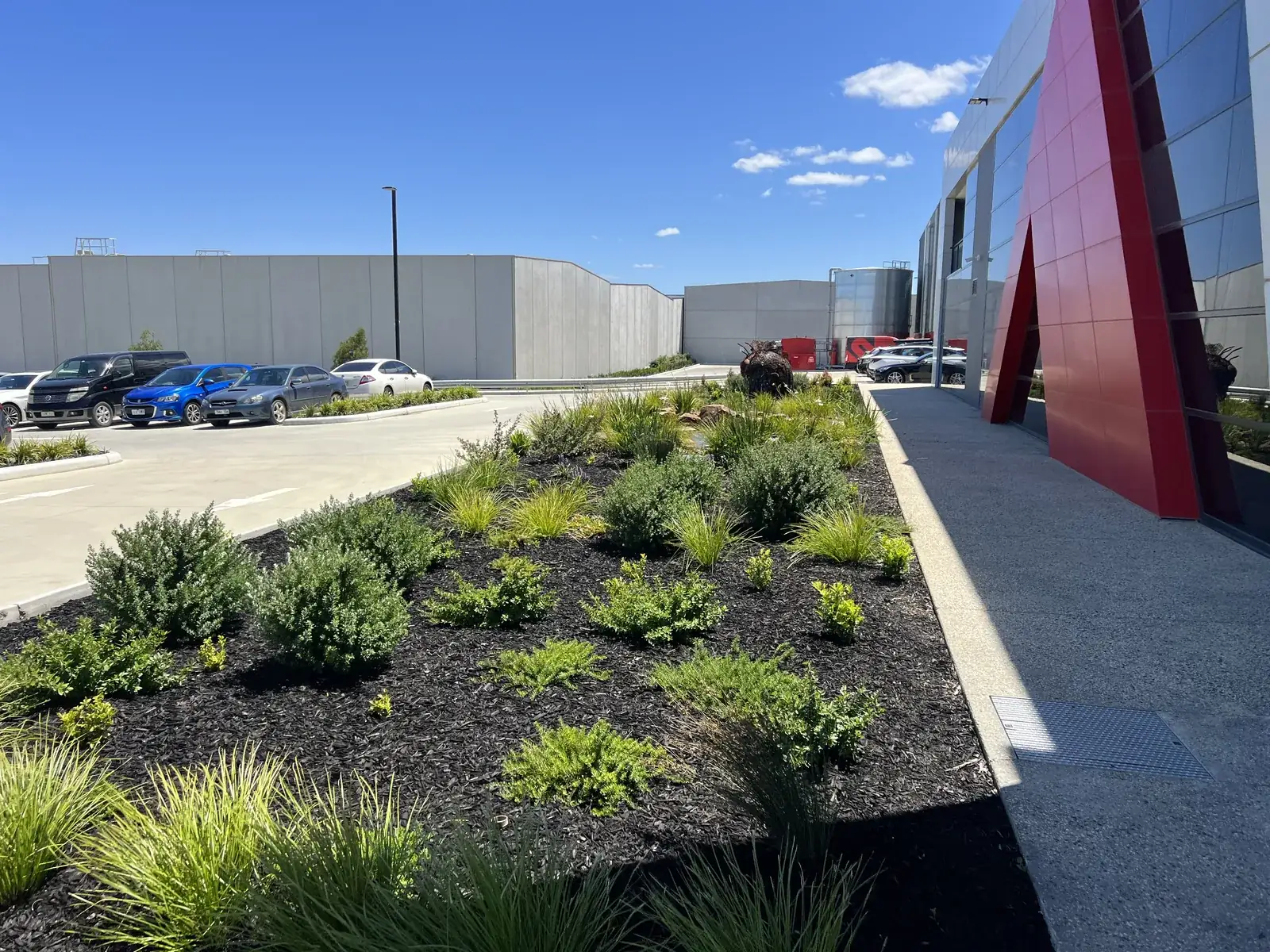 Industrial grounds maintenance, a mown and edged factory frontage in south-east Melbourne